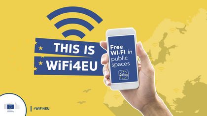 Grafika - ręka trzymająca smartfon oraz logo połączenia wifi